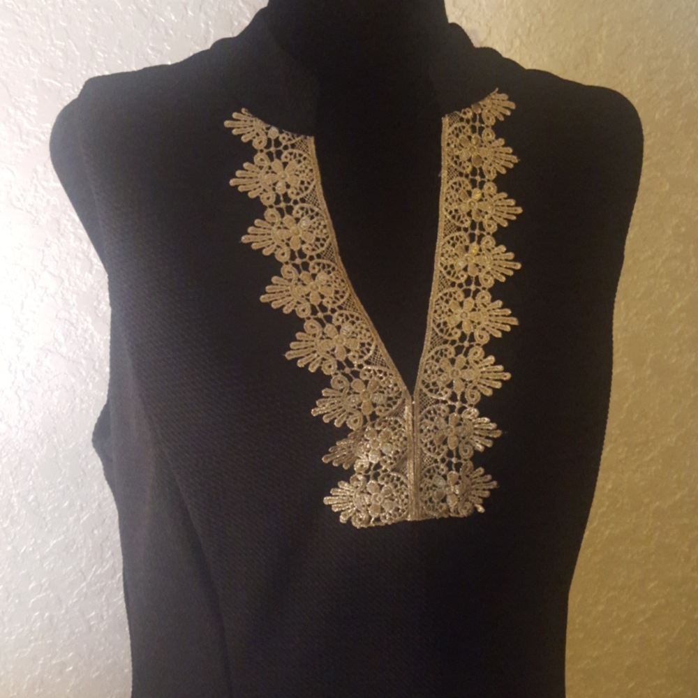 Black and gold dress. Lined and zips in the back